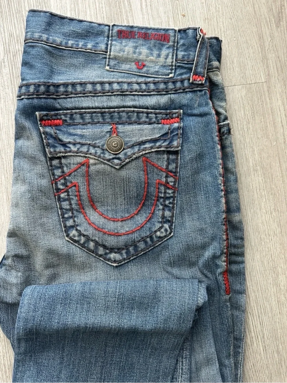 True Religion Faded Blue Slim Straight Jeans with Subtle Whiskering